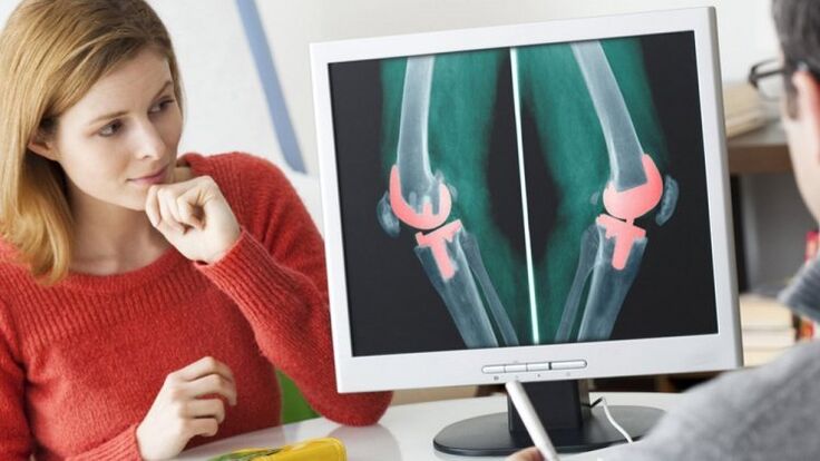 girl on examination by a doctor with osteoarthritis